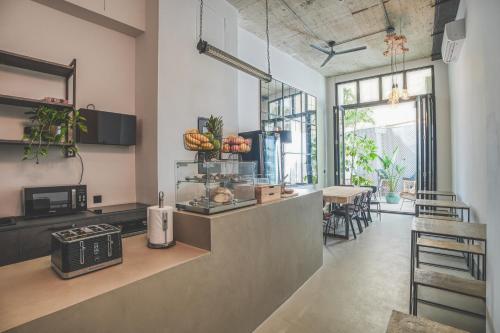 a kitchen with a counter and a dining room at The Bear and Ween in St Julian's