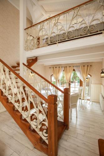 a staircase in a house with wooden railings at Hotel Casablanca Spa & Wine in Casablanca