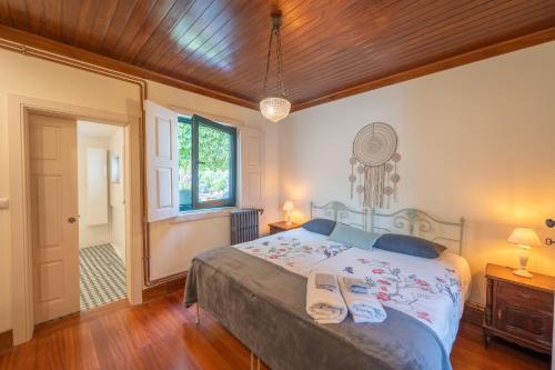 Ένα ή περισσότερα κρεβάτια σε δωμάτιο στο Feel Discovery Casa do Rio Douro Valley