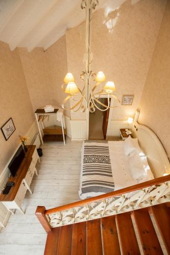 a large room with a bed and a chandelier at Hotel Casablanca Spa & Wine in Casablanca