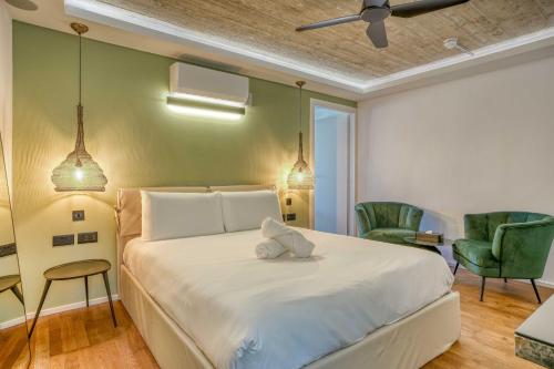 a bedroom with a bed with a stuffed animal on it at The Bear and Ween in St Julian's