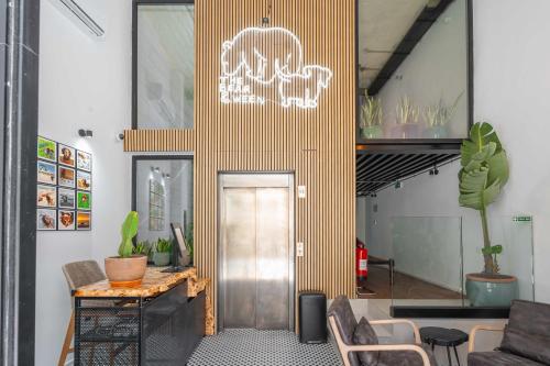 a lobby with a door with a skull on the wall at The Bear and Ween in St Julian's