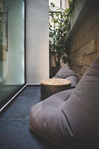 a living room with a couch and a table at The Bear and Ween in St Julian's