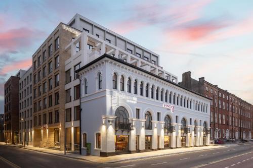 a rendering of a white building on a city street at Residence Inn by Marriott Cork in Cork