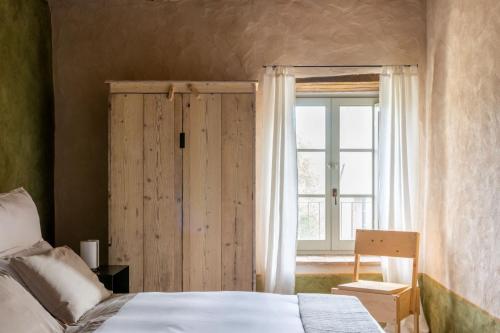 Katil atau katil-katil dalam bilik di Agriturismo Borgo d'Asso