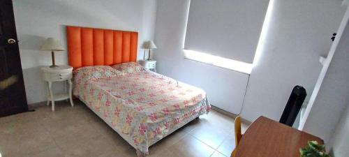 Кровать или кровати в номере Apartamento Vacacional centro San Gil