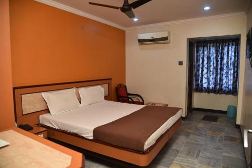 מיטה או מיטות בחדר ב-Hotel Chela