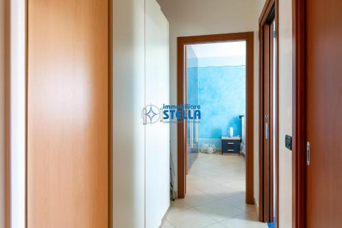 a hallway with a door leading to a room at Archimede in Lido di Jesolo