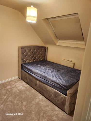 a bedroom with a large bed in a room at 69 swan lane in Coventry