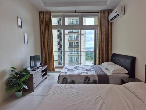 a bedroom with a bed and a large window at Good view stay in Kuching