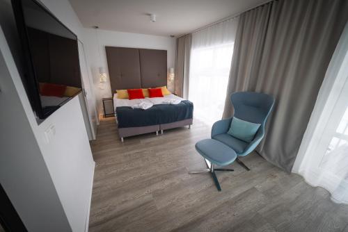 Cama o camas de una habitación en Hotel Hamar
