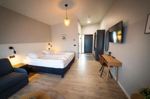 Cama o camas de una habitación en Hotel Hamar
