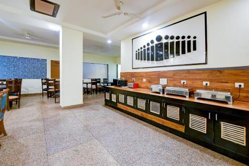 a dining room with a table and some chairs at Majestic Park B & B At Airport in New Delhi
