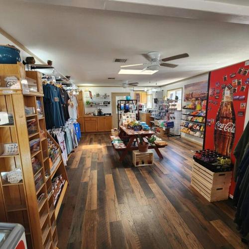 a room with a store with wooden floors and a room with a store at Desert Glamping Getaway Near Moab Arches NP in Moab