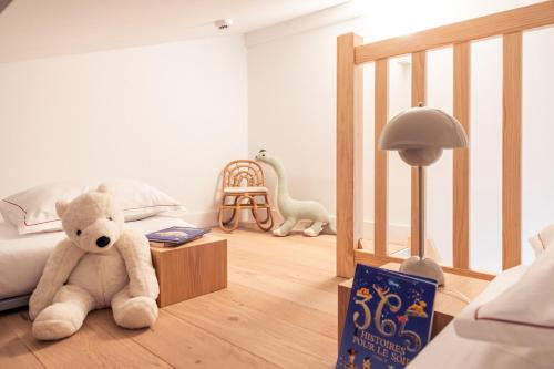 Ένα ή περισσότερα κρεβάτια σε δωμάτιο στο Hôtel INDARRA & SPA - Piscine