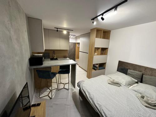 Posteľ alebo postele v izbe v ubytovaní Style apartment studio Kabeny