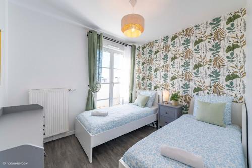 Postel nebo postele na pokoji v ubytování Le Cartier Appt F3, 7mn Disneyland, Parking,Terrace