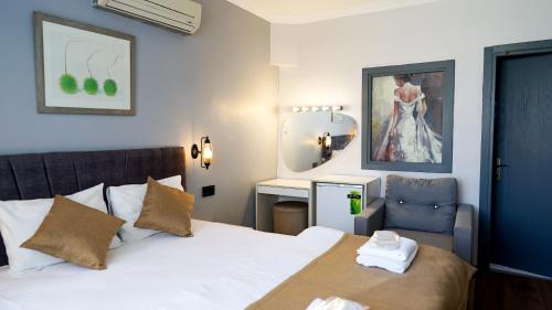 Katil atau katil-katil dalam bilik di Front Door Suites