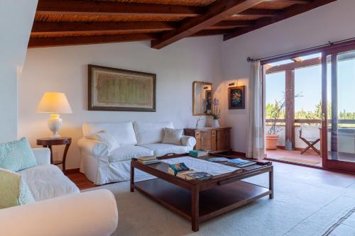 a living room with a couch and a coffee table at Nora Club Hotel & Spa in Pula