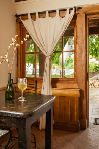 a glass of wine on a table in front of a window at Hotel Casablanca Spa & Wine in Casablanca