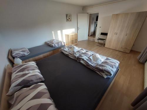 a room with two beds in a room at Apartma MILA in Šempas