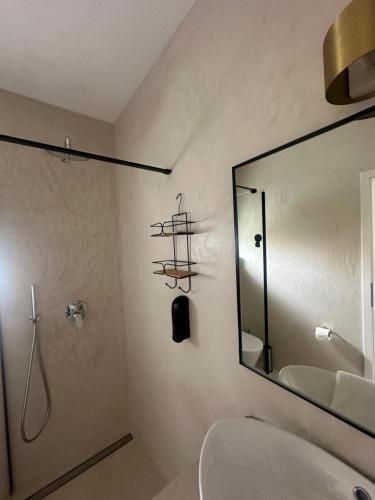 a bathroom with a sink and a mirror at Villa MARIGI in Medulin