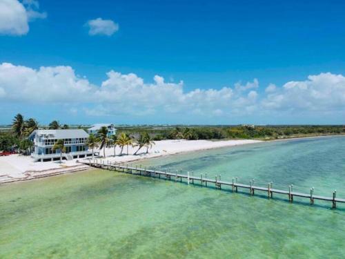an aerial view of a beach with a pier at Palms Resort Main House - Key West in Sugarloaf Shores