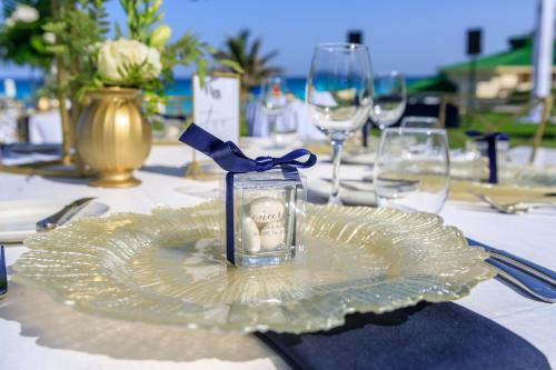a glass jar on a plate on a table at Iberostar Selection Cancun - All Inclusive in Cancún