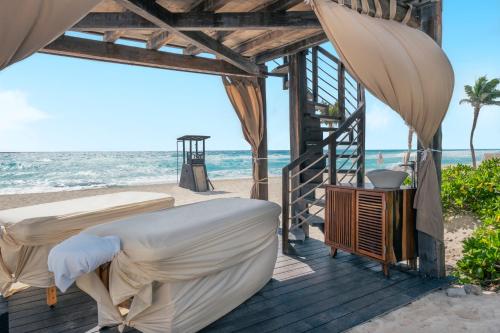a bedroom with two beds on the beach at Iberostar Selection Cancun - All Inclusive in Cancún