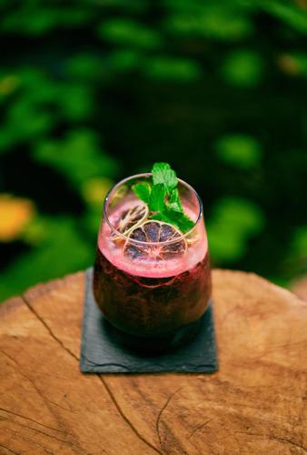 a drink sitting on top of a table at Hidden Valley Wilderness Lodge in San Ignacio