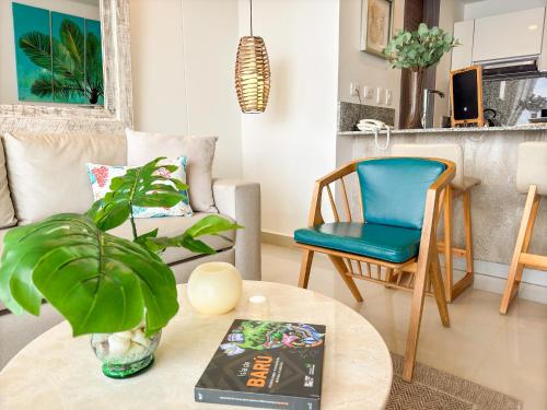 a living room with a table and a chair at Namaste Alojamientos Luxury Cartagena in Cartagena de Indias