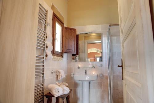 a bathroom with a sink and a mirror at Tenuta Monacelli Lecce in Lecce
