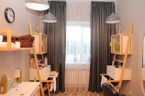 a makeup room with a vanity and a window at Hotel Vesna in Truskavets