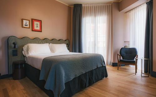 Uma cama ou camas num quarto em c-hotels Joy