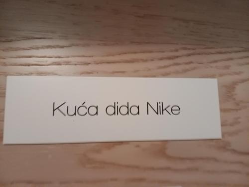 a sign that says koda added nike on a table at Dida Joja in Lički Osik