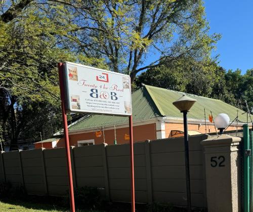 a sign in a yard in front of a house at Twenty 4 Hr Self-Catering Accomodation in Mthatha