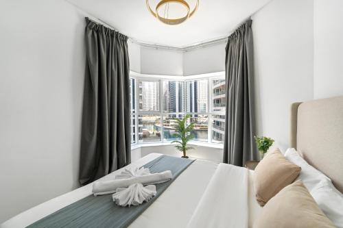 Кровать или кровати в номере Modern Studio Apartment in JLT