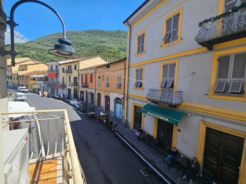 a view from a balcony of a street with buildings at La Casa di Colombetta in Badalucco