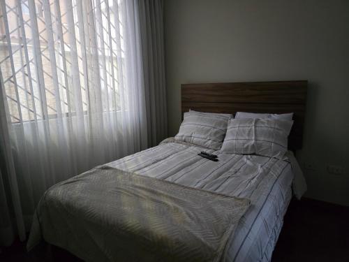 En eller flere senge i et værelse på Casa en condominio