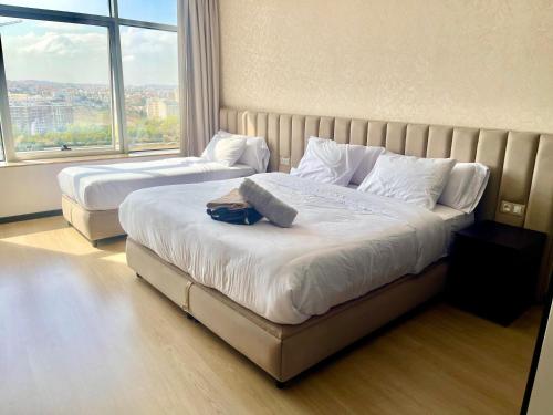 Postel nebo postele na pokoji v ubytování Hilton Tanger City Center Residence