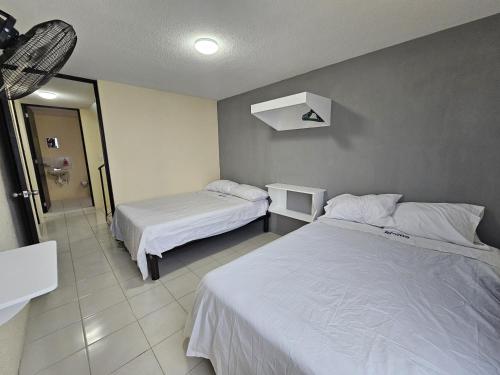 Ένα ή περισσότερα κρεβάτια σε δωμάτιο στο Sensity Home Casa viveros, Amplia, Espaciosa y Hogareña