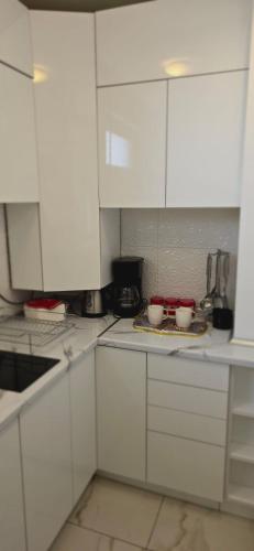 Una cocina o zona de cocina en Bella apartman
