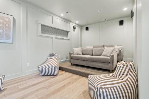 a living room with a couch and two chairs at Summer Salt 10 Bedroom Home at Hattie Creef Landing in Salvo