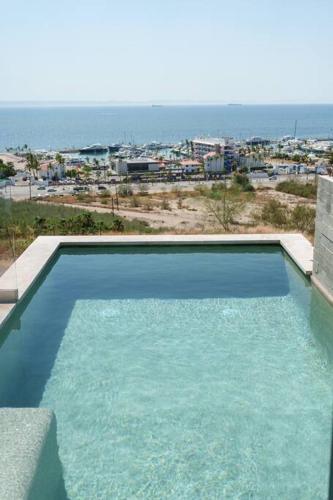 a swimming pool with a view of a city at Amazing Ocean View House With Private Pool in La Paz