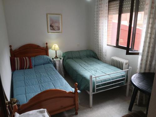 Кровать или кровати в номере Habitacion Privada Doble en Toledo