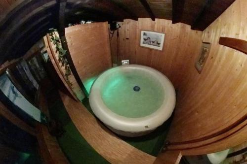 an overhead view of a bathroom with a bath tub at Ski liviomoritz at gma il com Chalet in Madzhare