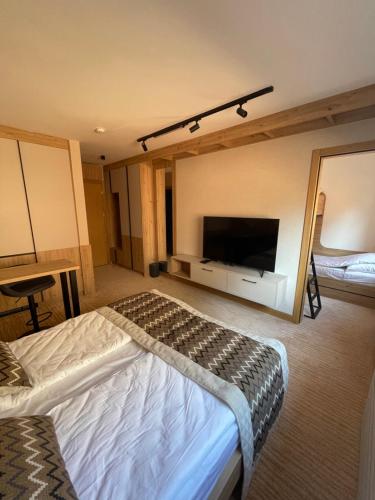 Ένα ή περισσότερα κρεβάτια σε δωμάτιο στο Apartman Jahorina D239 Vucko privatni apartman