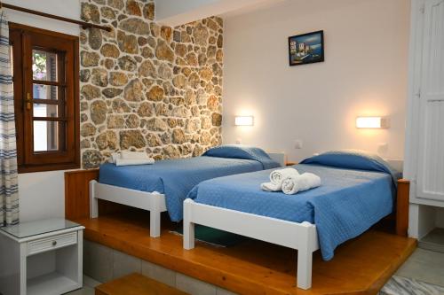Ένα ή περισσότερα κρεβάτια σε δωμάτιο στο Galini View Studios & Apartments
