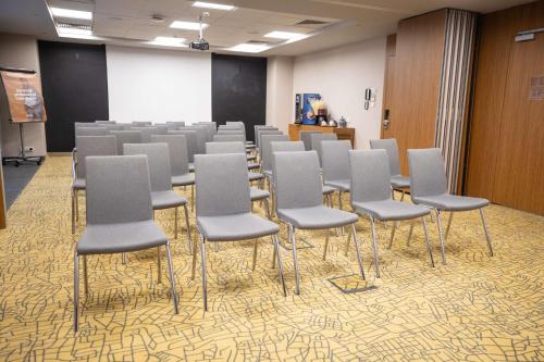 a room with rows of chairs in a room at Park Inn by Radisson Istanbul Atasehir in Istanbul