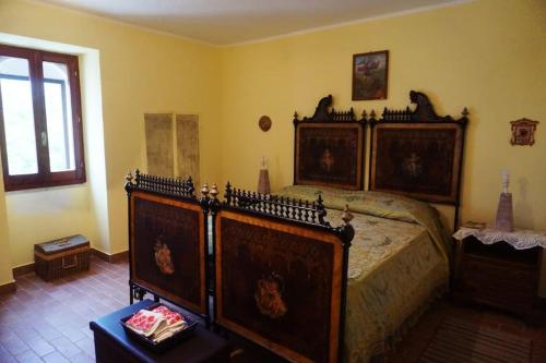 a bedroom with a large bed in a room at La Campagna del Benessere in Gildone